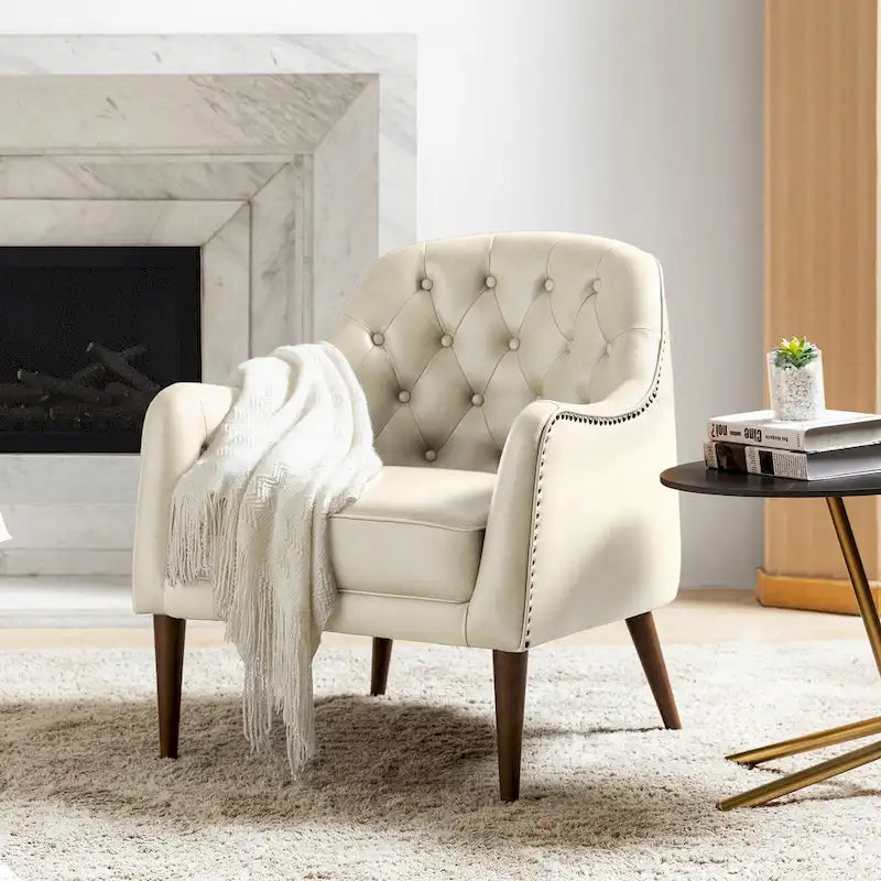 Sillón barril con respaldo capitoné y patas de madera